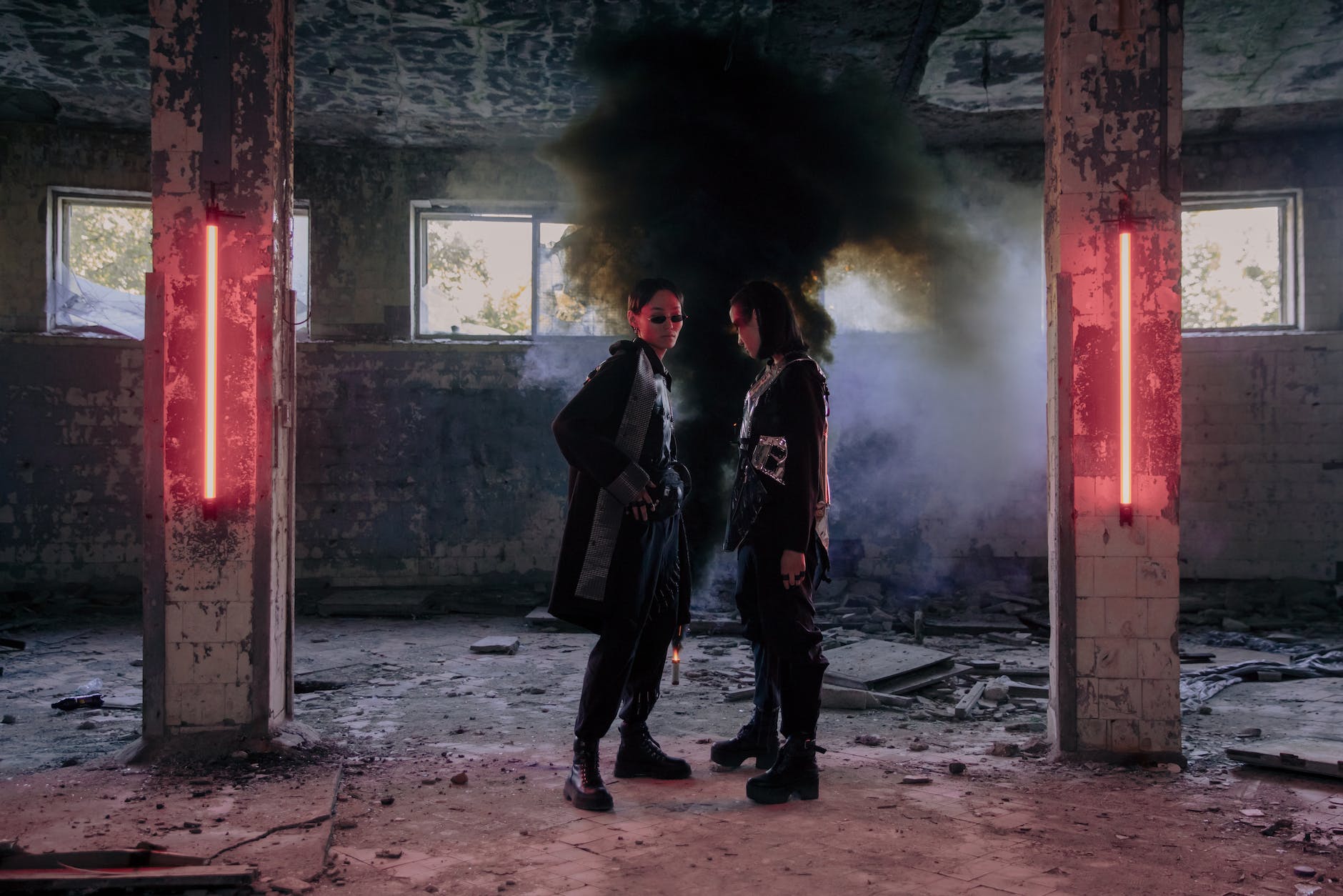 man in black suit standing beside woman in black coat